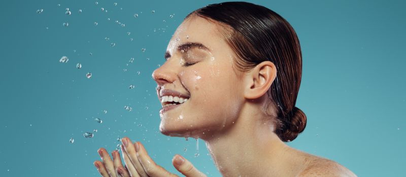 A girl washing face with Nivea Shine-Control Face Wash