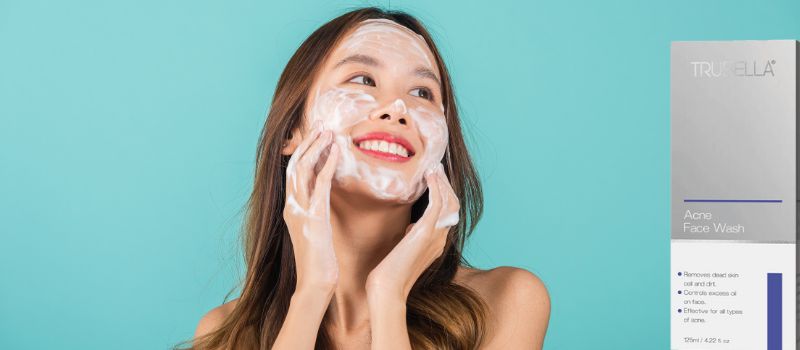 Girl looking at trubella acne face wash