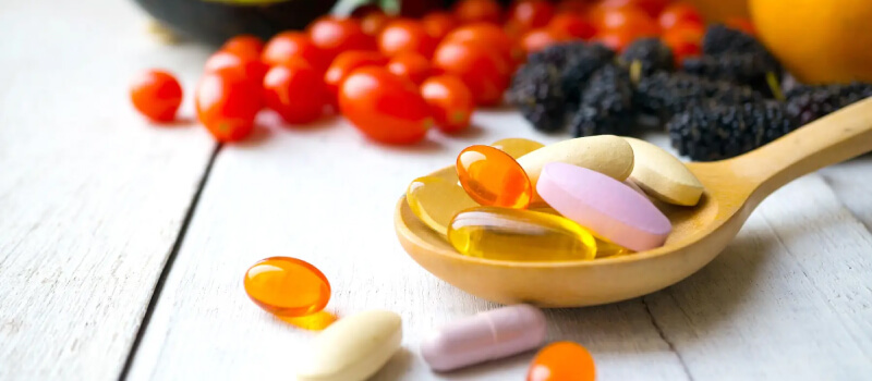 a spoonful of pills and tomatoes