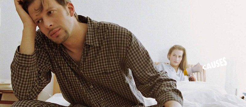 a man sitting on a bed