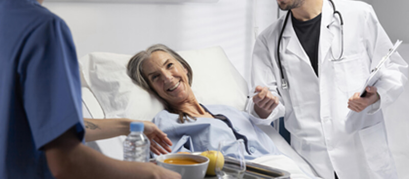 a woman lying in a hospital bed understanding chronic conditions