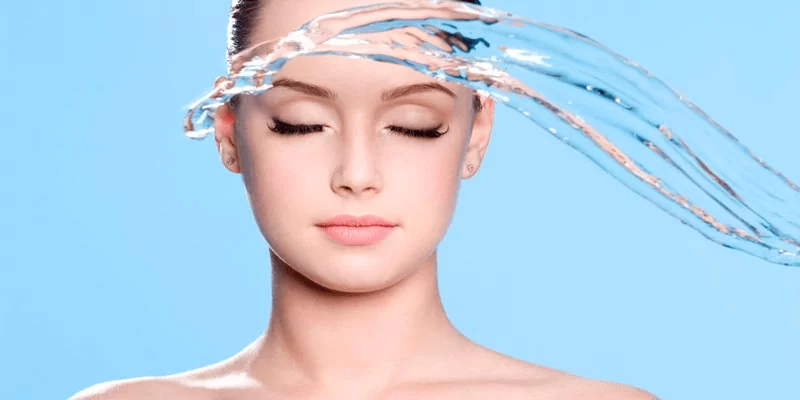 water is falling on white hydrating skin