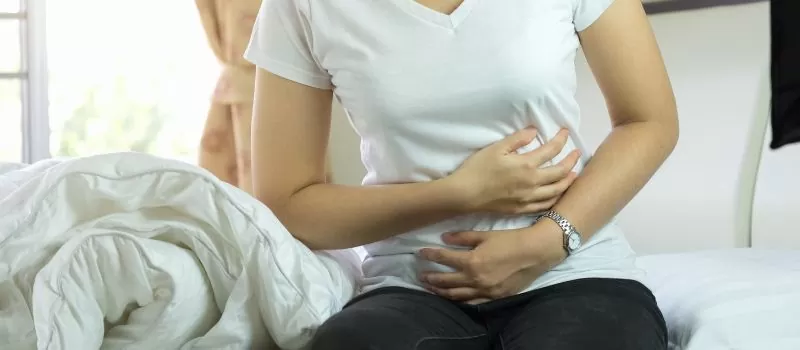 a person holding her stomach