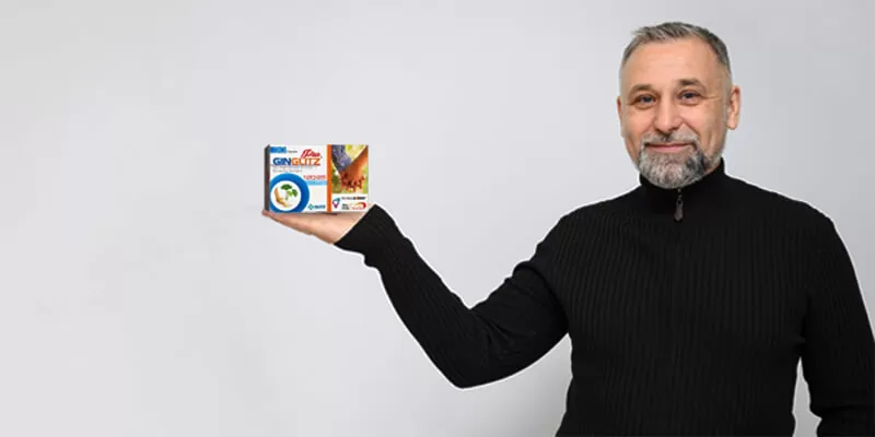 A man holds a box of cereal, promoting the incorporation of Ginglitz Plus into his daily routine.