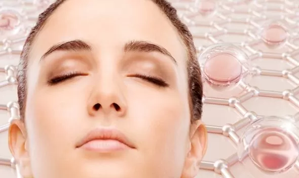 A woman with closed eyes against a pink background, symbolizing tranquility and the benefits of collagen for radiant skin.