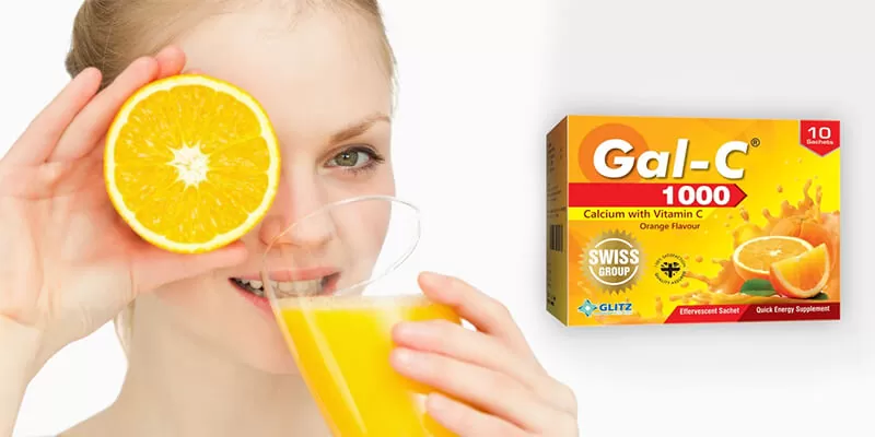 A woman proudly displays a box of gal-c 1000 in her hands, showcasing the product's features, branding, and benefits of vitamin c sachets pack.